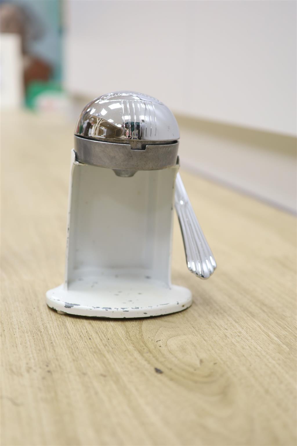 Early 20th century metal toaster and electric fan and lighthouse lamp and juicer